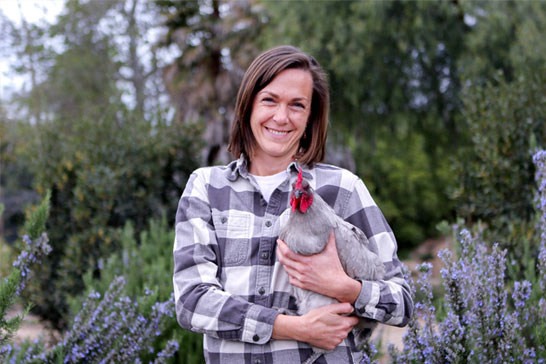 Molly Chester holding rooster